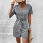 European and American leisure vacation lace up button decoration solid color V-neck jumpsuit