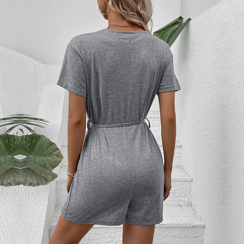 European and American leisure vacation lace up button decoration solid color V-neck jumpsuit